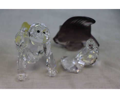 Post war Lalique amethyst glass model of a fish, signed Lalique France, together with a Swarovski Gorilla (af) and a Swarovsk