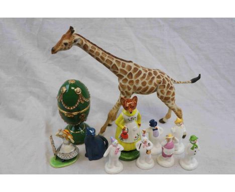 Ceramic items to include a realistically modelled giraffe, six Coalport The Snowman characters, a figure of a clothed fox etc