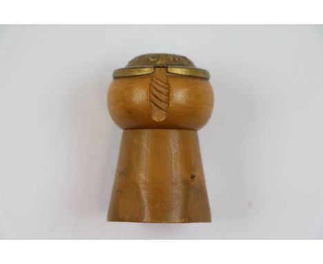Novelty carved hardwood and brass lighter in the form of a champagne cork, height approximately 5cm