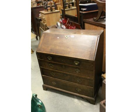 Georgian Oak Bureau with Four Drawers and raised on bracket feet