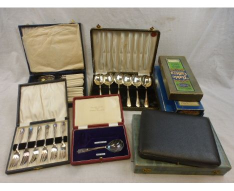 Cased flatware to include a set of fish knives and forks, cased set of butter knives, cased set of cake forks, fruit spoons a