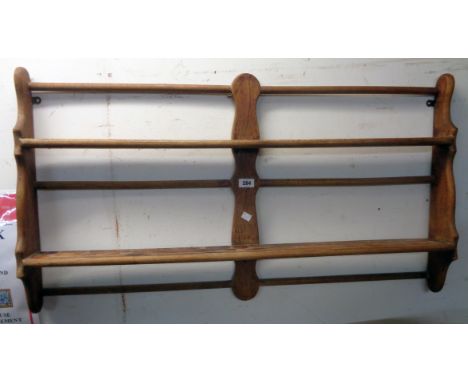 A 3' 5" elm wall mounted two shelf open plate rack