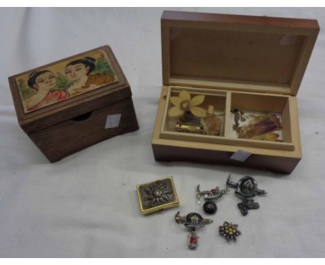 A Swiss musical box containing related badges, etc. - sold with a playing card box 