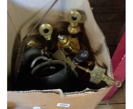 A quantity of brass and pewter including tankards, powder flask, etc.