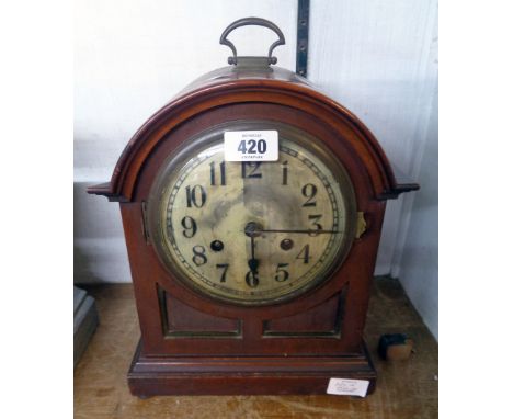 An early 20th Century mahogany and stained wood cased dome top bracket clock with Arabic numerals to dial and simple eight da