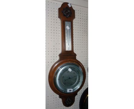 A mid 20th Century Smiths oak cased banjo barometer/thermometer with applied decoration, printed dial and aneroid works