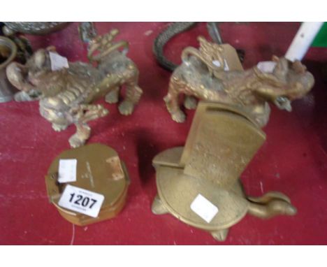 Two brass lions, bookends, and reproduction compass