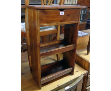 A 17 1/4" stained hardwood two shelf bedside unit with drawer to top