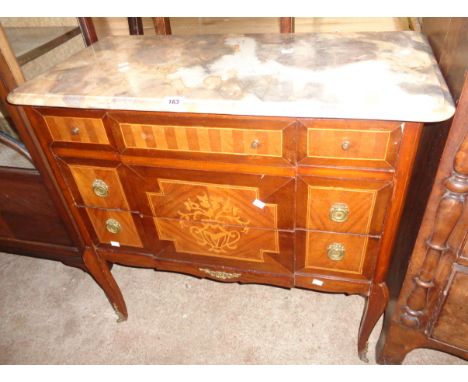 A 33" French marble topped commode chest with three break front long drawers featuring inlaid mixed wood decoration, set on c