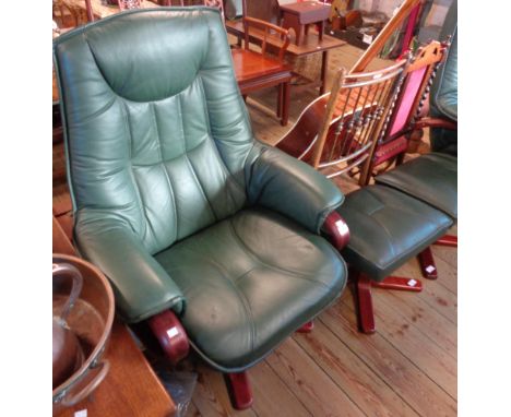 A modern reclining easy chair with polished bentwood frame and green leather upholstery - sold with a footstool to match