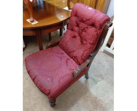 A Victorian walnut part show frame drawing room chair upholstered in burgundy button back floral tapestry, set on turned and 