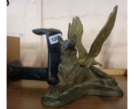 A brass eagle - sold with a resin German Shepherd dog (a/f), a cobbler's last and a fire screen