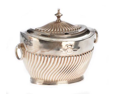 EMBOSSED SILVER OVAL TEA CADDY WITH A HINGED LID, URN SHAPED FINIAL AND RING DROP HANDLES ON AN OVAL REEDED BASE, LONDON 1903