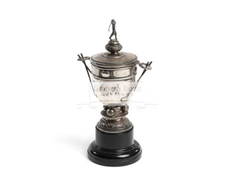 A silver golf trophy 1935,hallmarked Walker & Hall, Sheffield, 1935, in the form of a small cup & cover with golf club handle