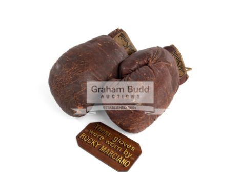 A pair of Rocky Marciano boxing gloves,brown leather by Goldsmith of Cincinnati; together with a wooden display plaque with g