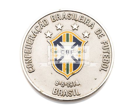 A 1994 World Cup Brazilian Football Association (CBF) medal,white metal & enamel, depiction of the World Cup trophy, inscribe