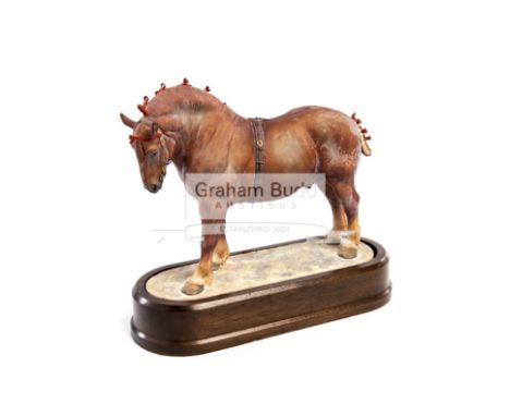 A Limited Edition Royal Worcester Suffolk Stallion porcelain figurine by Doris Lindner, circa 1969modelled standing on a gras