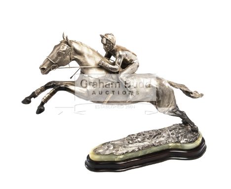 A large and impressive sterling silver sculpture of Desert Orchid with Simon Sherwood up, hallmarked London 1990 by Garrard &