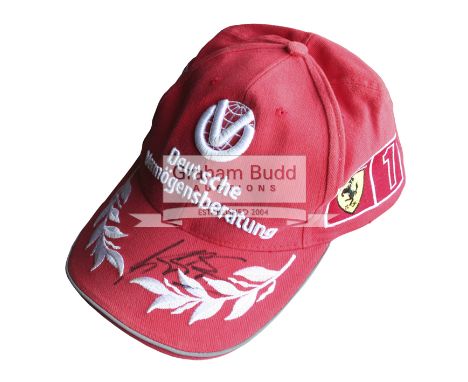 Michael Schumacher signed F1 World Champion 2000 DVAG Ferrari post-race cap, his marker pen signature upon the red peak with 