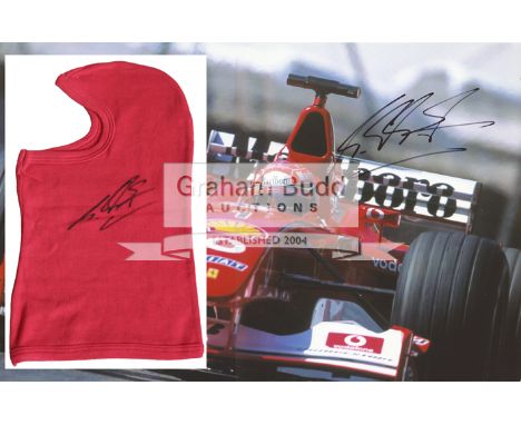 Michael Schumacher signed red F1 style balaclava, his black marker pen signature across the left-hand cheek; sold together wi