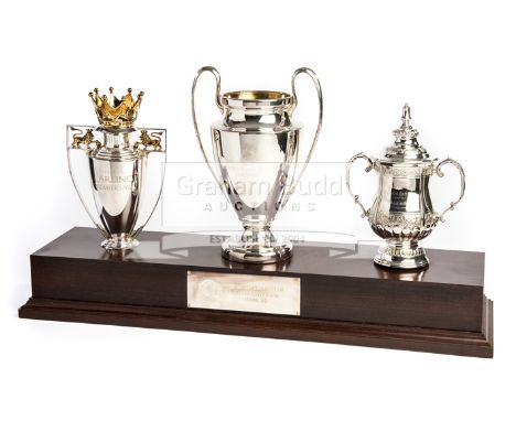 A set of Manchester United 1998-99 Treble Winning season hallmarked sterling silver scale replicas of the Premier League, F.A