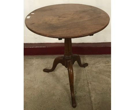 A George III mahogany tilt top tripod wine table 