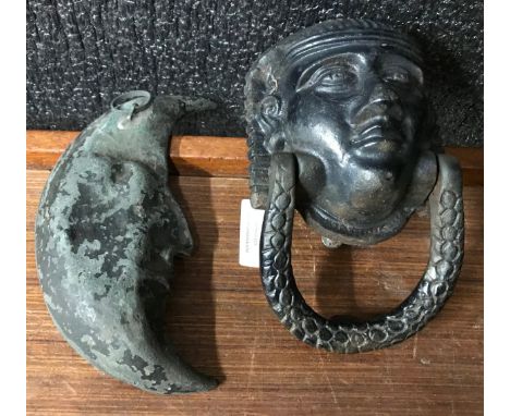 An Egyptian revival cast iron door knocker and a crescent moon 
