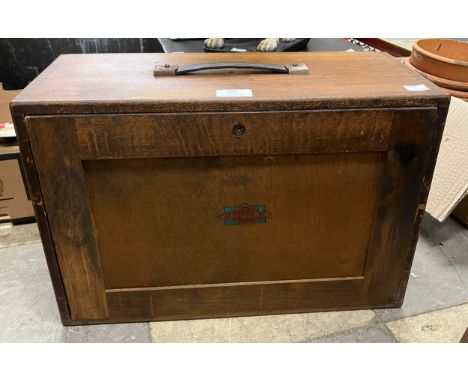 An early 20th Century oak engineers chest, containing tools