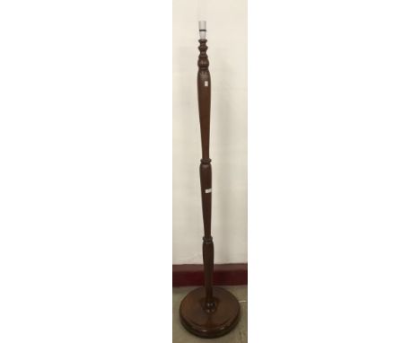 A mahogany standard lamp 