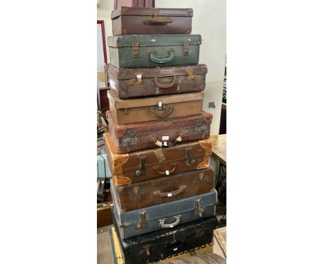 Ten assorted vintage suitcases 