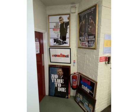 Five framed movie and other posters and two automobile prints.