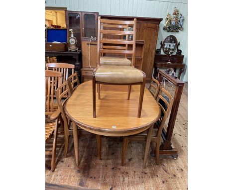 G Plan teak cocktail sideboard, oval extending dining table and set of six ladder back dining chairs.