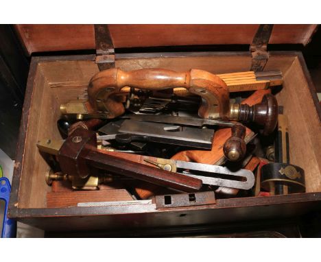 Mahogany box of vintage tools including brace, gauges, planes, etc.