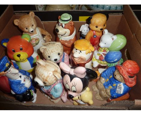 Selection of ceramic money boxes inc Paddington Bear, Barney Rubble, Yogi Bear, Sooty, Postman Pat etc