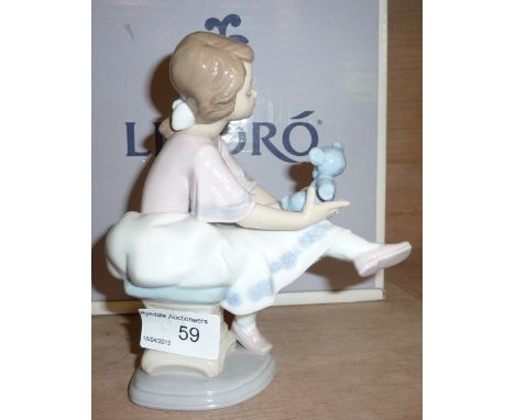 Lladro figurine of a young girl holding a teddy bear 7620 (with original box)