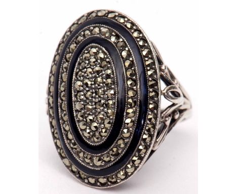 Art Deco style white metal enamel and marcasite large dress ring, oval shaped with two bands of blue translucent enamel and d