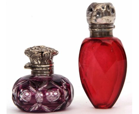 Mixed Lot: comprising two various Victorian cut glass scent bottles, the first of ovoid form with hinged cover and ground in 