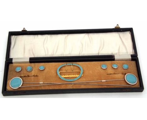 Cased gilt metal and enamel set to include a buckle, hat pin, six buttons decorated with blue and white enamel detail  
