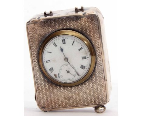 George V boudoir timepiece, the engine turned rectangular case (damaged, lacking handle and one bun foot) to a Roman enamel d