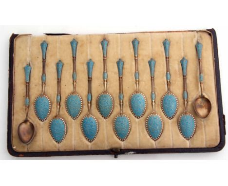 Cased set of twelve Norwegian Victorian silver gilt and enamelled coffee spoons, of frosted gilt form with turquoise blue and