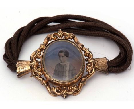 Victorian hair bracelet with a gilt metal portrait glazed clasp, having a photographic portrait of a young boy, verso glazed 