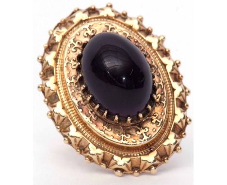 Early 20th century 9ct gold and amethyst dress ring, the large oval Etruscan style mount set with a large oval cabochon ameth