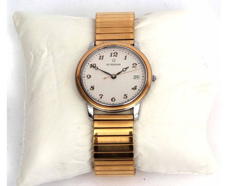 Gold plated and steel quartz centre seconds calendar wrist watch, Eterna, the quartz movement to an engine turned dial with a