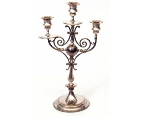 Early 20th century electro-plated three-light candelabra with three urn shaped sconces over flared drip pans (one lacking) to