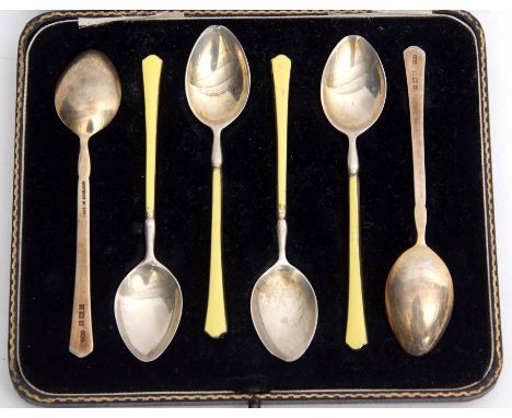 Cased set of six Elizabeth II silver gilt and enamelled coffee spoons, each with lemon yellow enamel detail (slight damage) i