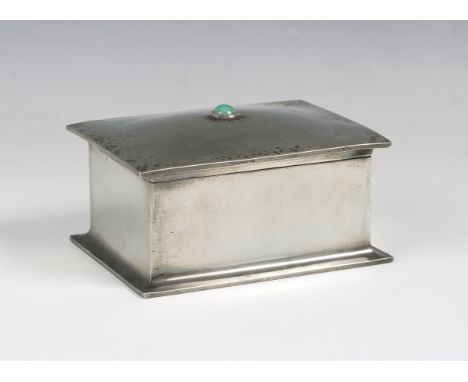 A Liberty &amp; Co 'Tudric' pewter box, model number '082', the hinged lid inset with a turquoise cabochon, the underside bea
