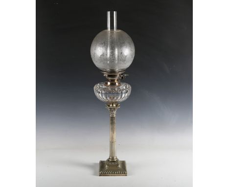 An Edwardian Neoclassical Revival plated Corinthian column table oil lamp by Hinks, the etched globular shade above a cut gla