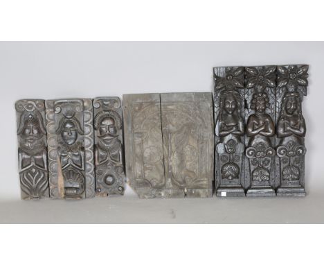 A group of 17th century and later carved oak panels and pilasters, including a set of three figural herm mounts, 48cm x 11cm.
