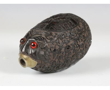 A 19th century coconut 'bugbear' shot flask, one end typically modelled with a face with inset glass eyes and a metal mounted