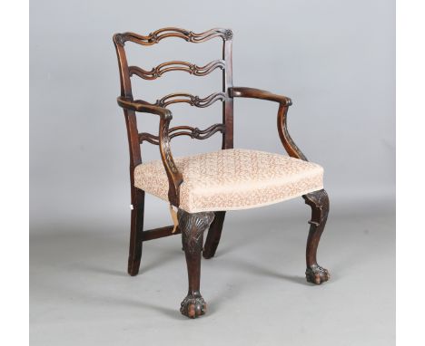 An early 20th century George III style mahogany framed pierced ladder back elbow chair with carved cabriole legs, height 95cm